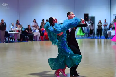 Dancesport competitor: Male dancer: black suit