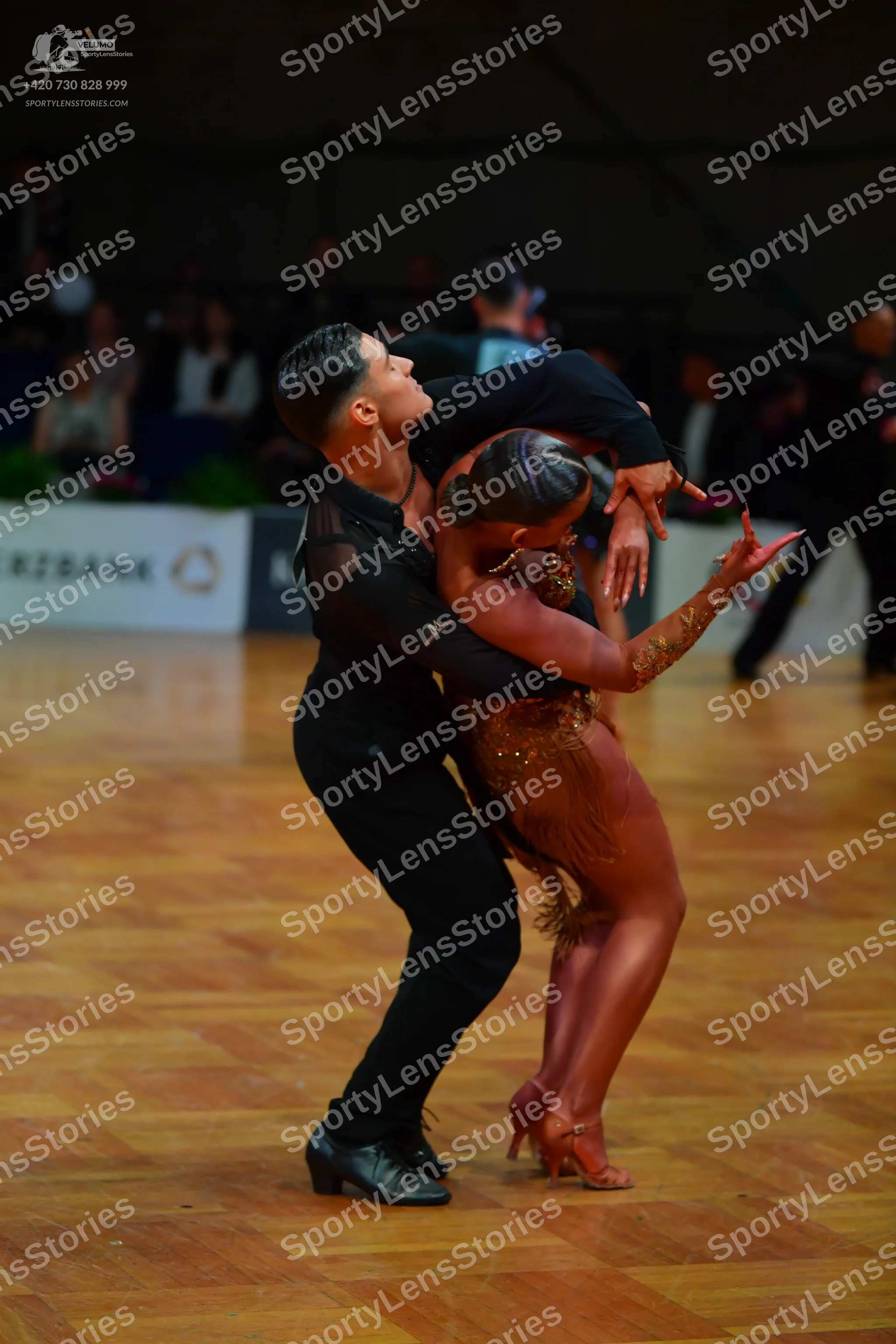 Dancesport competitor: Male dancer: black long-sleeved top and black trousers