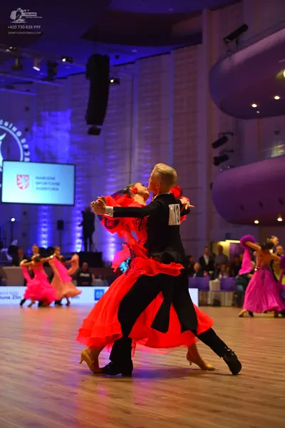 Dancesport competitor: Male dancer: black suit and trousers