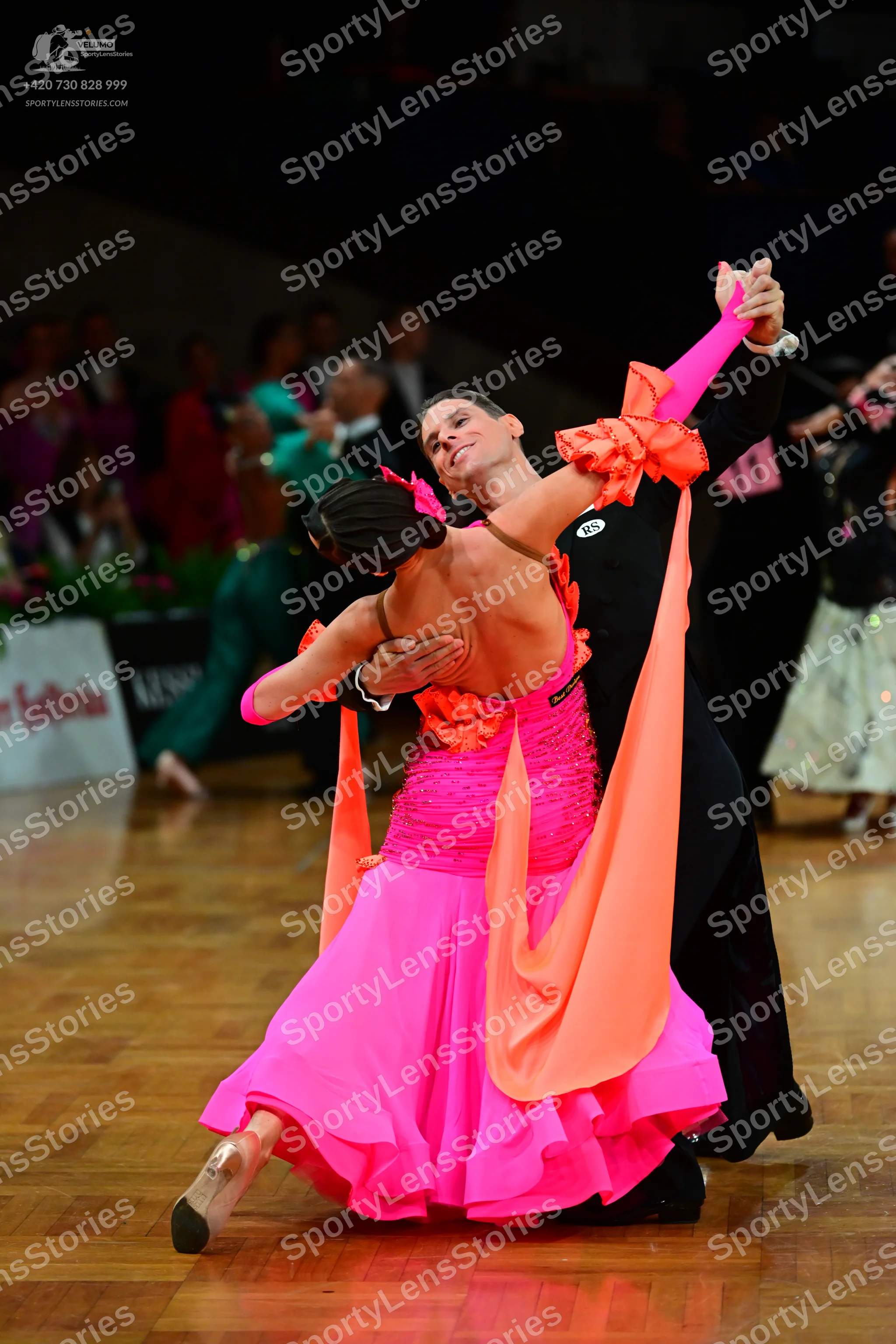 Dancesport competitor: Male dancer: black long-sleeved shirt and black trousers