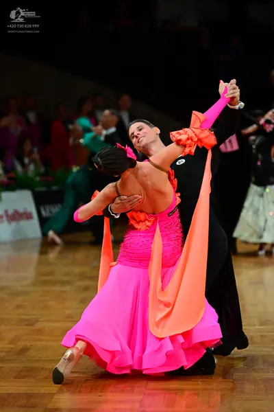 Dancesport competitor: Male dancer: black long-sleeved shirt and black trousers