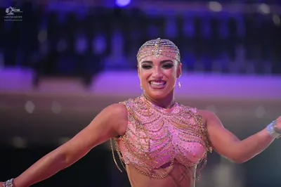 Dancesport competitor: Female dancer: pink latin-style top embellished with crystals and rhinestones, f