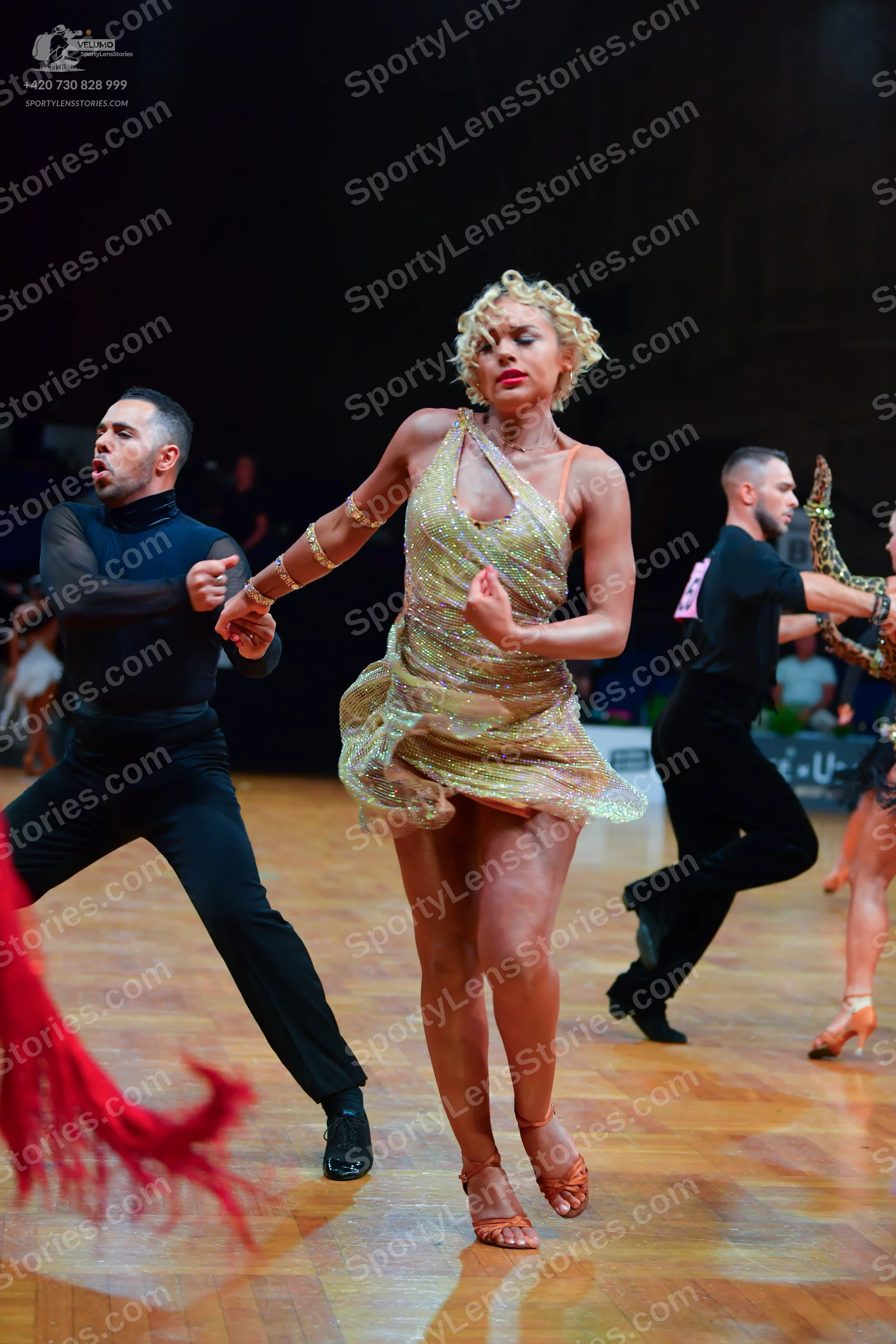 Dancesport competitor: Male dancer 1: black long-sleeved shirt and black trousers
