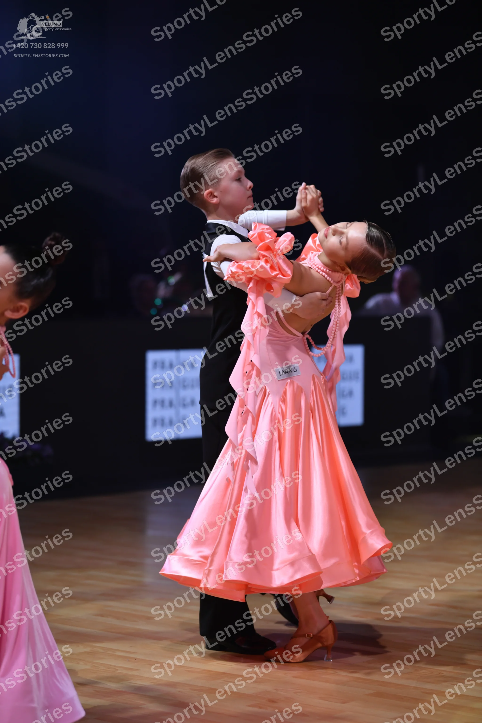 Dancesport competitor: Male dancer: black waistcoat over a white shirt and black trousers