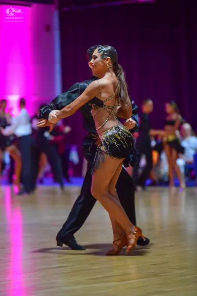 Dancesport competitor: Male dancer: black dance shirt and black trousers