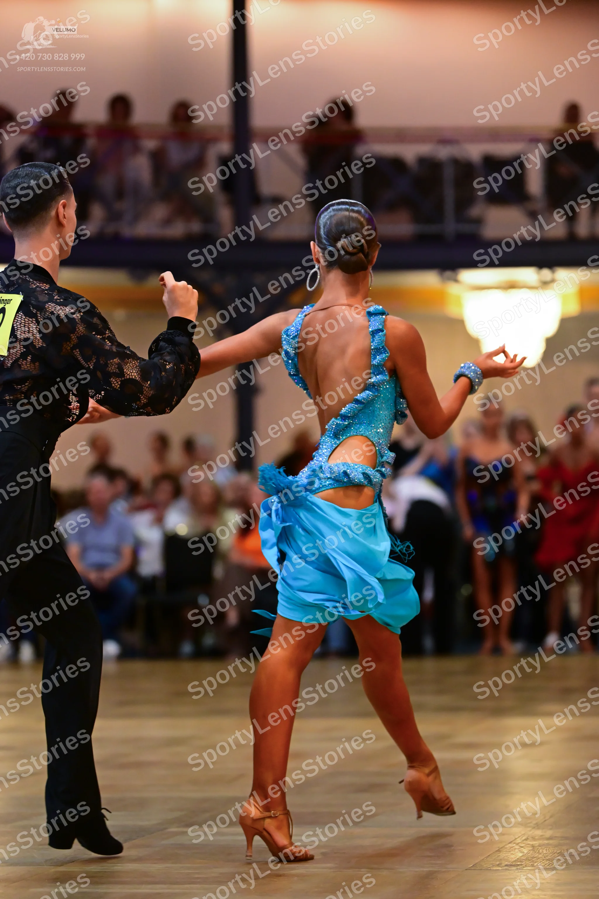 Dancesport competitor #73: Male dancer: black long-sleeved shirt with a floral lace pattern and black trous