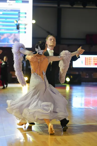 Dancesport competitor: Male dancer: black suit with a white shirt and white bow tie