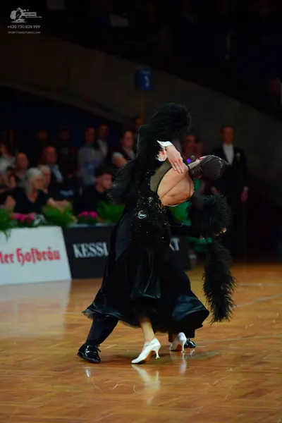 Dancesport competitor: Male dancer: black suit