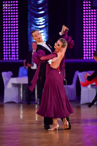 Dancesport competitor #73: Male dancer: black suit with a white shirt and white bow tie