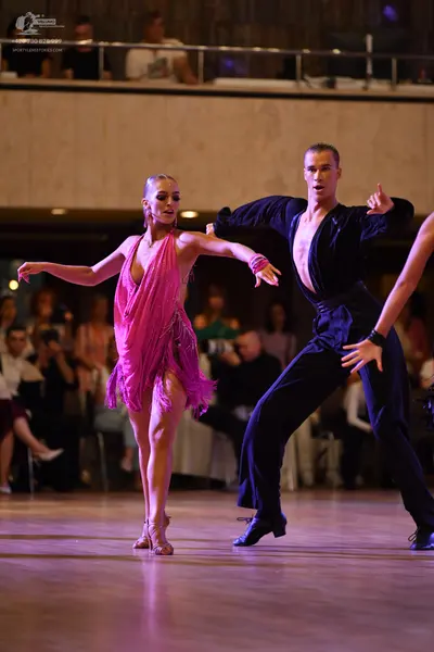 Dancesport competitor: ** Black tailsuit