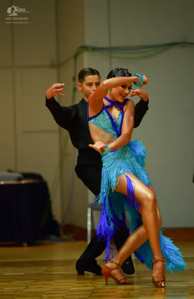 Dancesport competitor: Male dancer: black long-sleeved dance top
