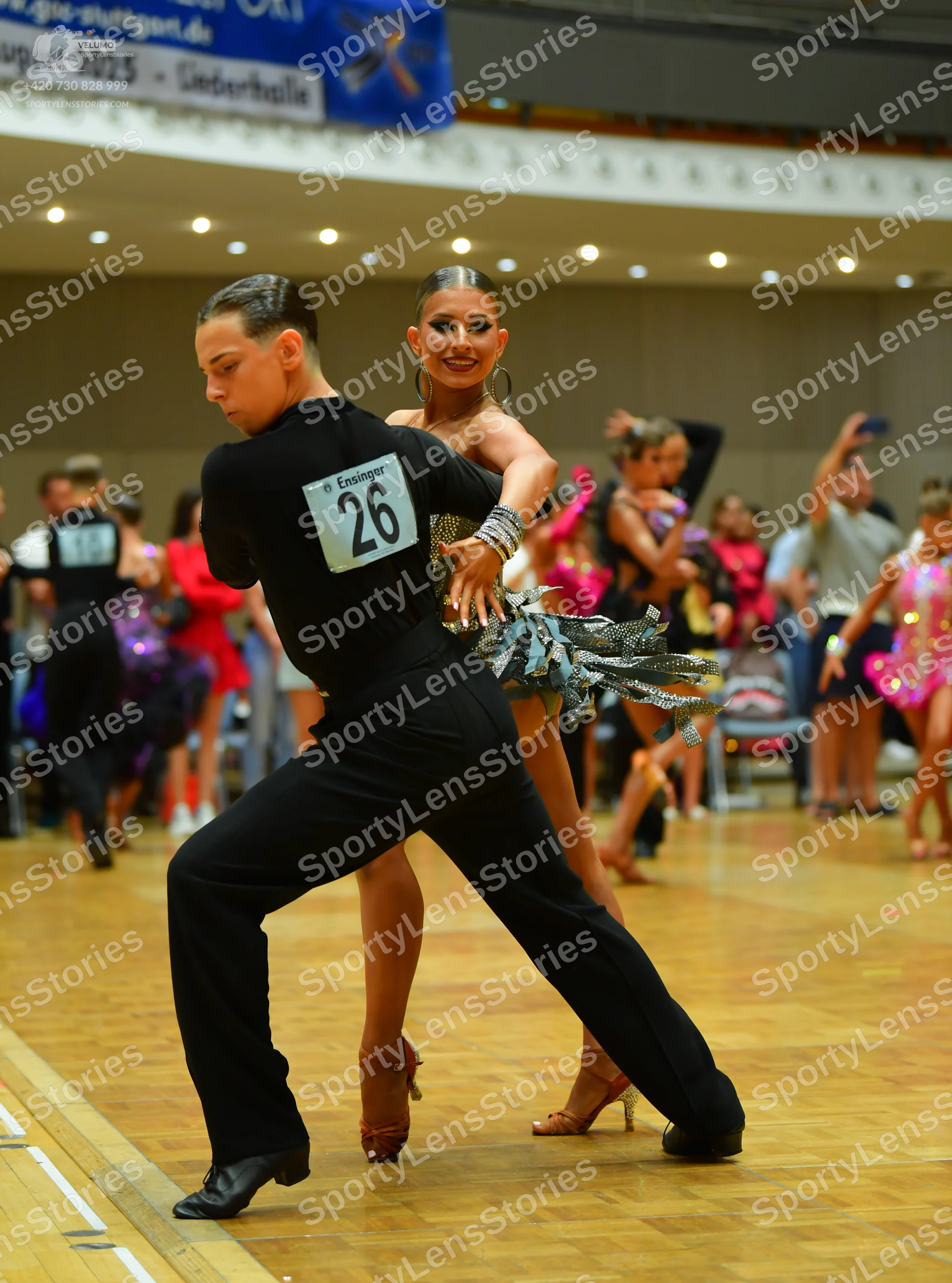 Dancesport competitor: Male dancer: black long-sleeved shirt and black trousers