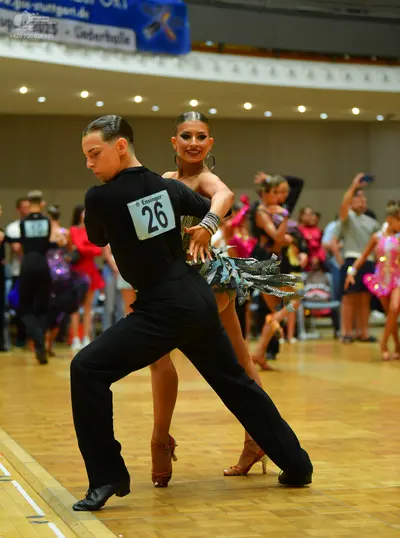 Dancesport competitor: Male dancer: black long-sleeved shirt and black trousers