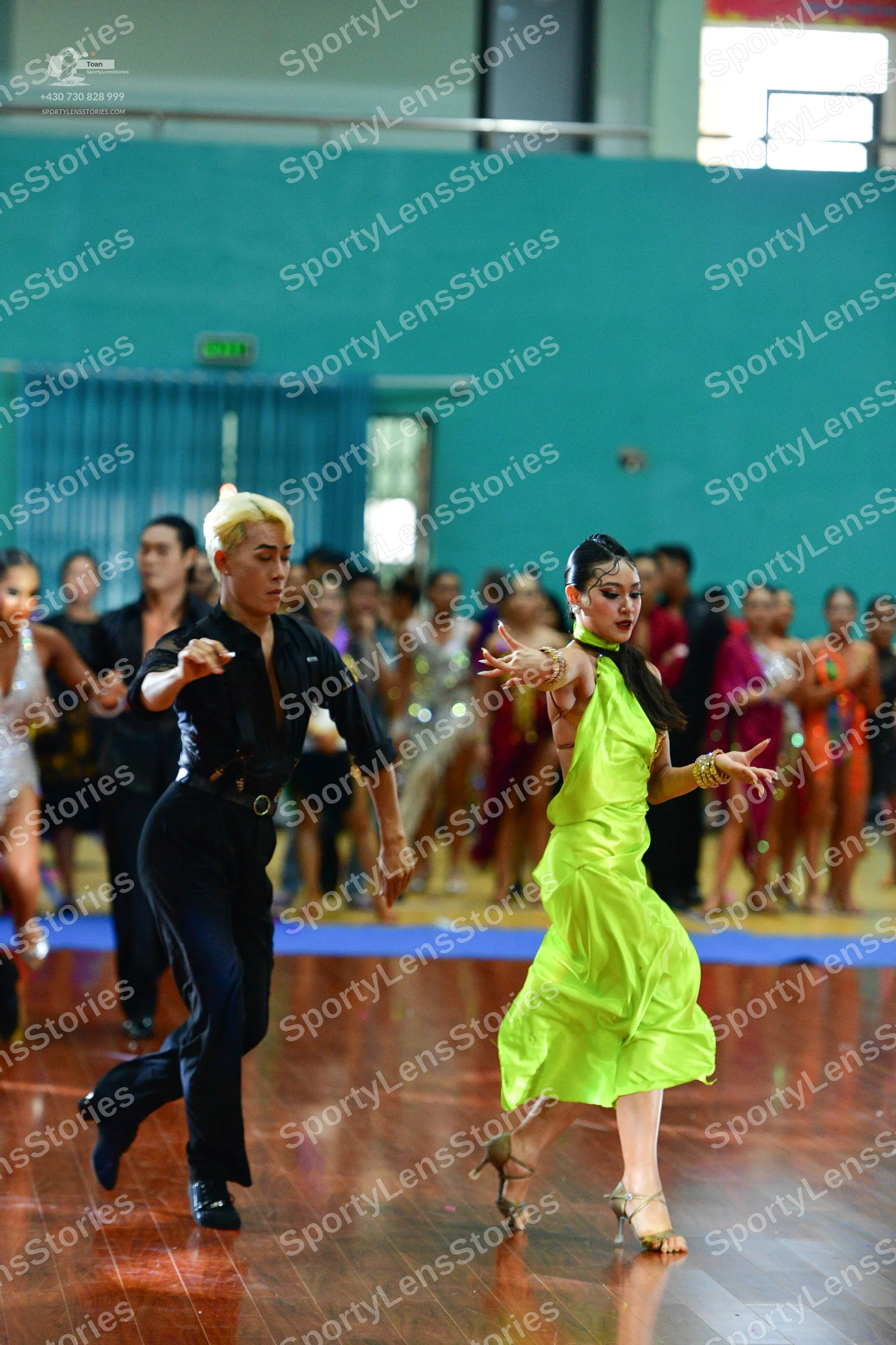 Dancesport competitor: ** Black tail suit
*   **Fabric:** Likely satin or a similar smooth fabric with 