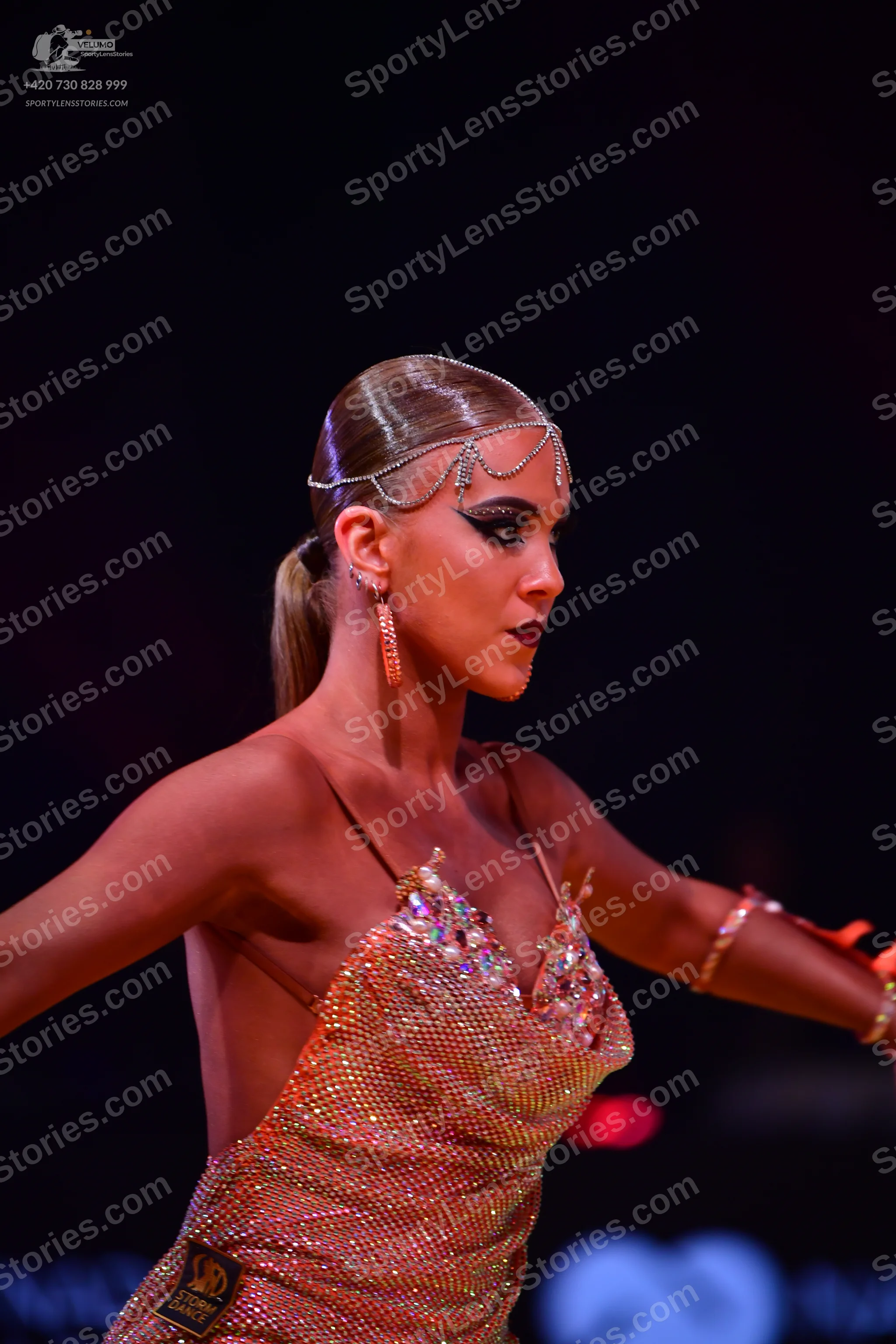 Dancesport competitor: Female dancer: rose gold sequined latin dress with thin straps and crystal embel
