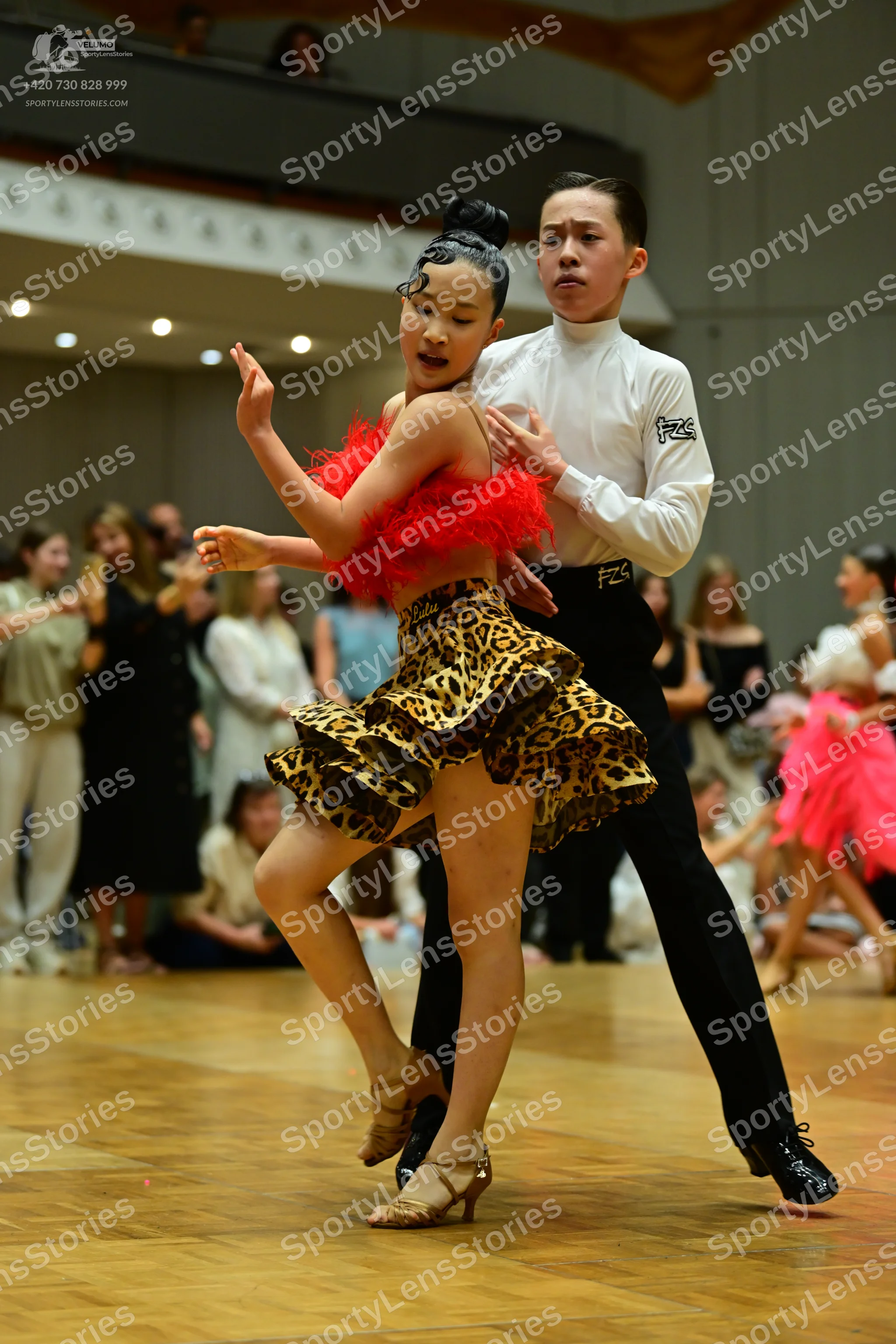 Dancesport competitor: Male dancer: white long-sleeved shirt and black trousers