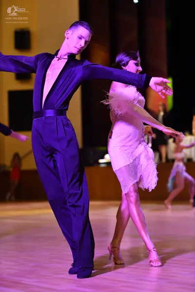 Dancesport competitor: ** Black tail suit