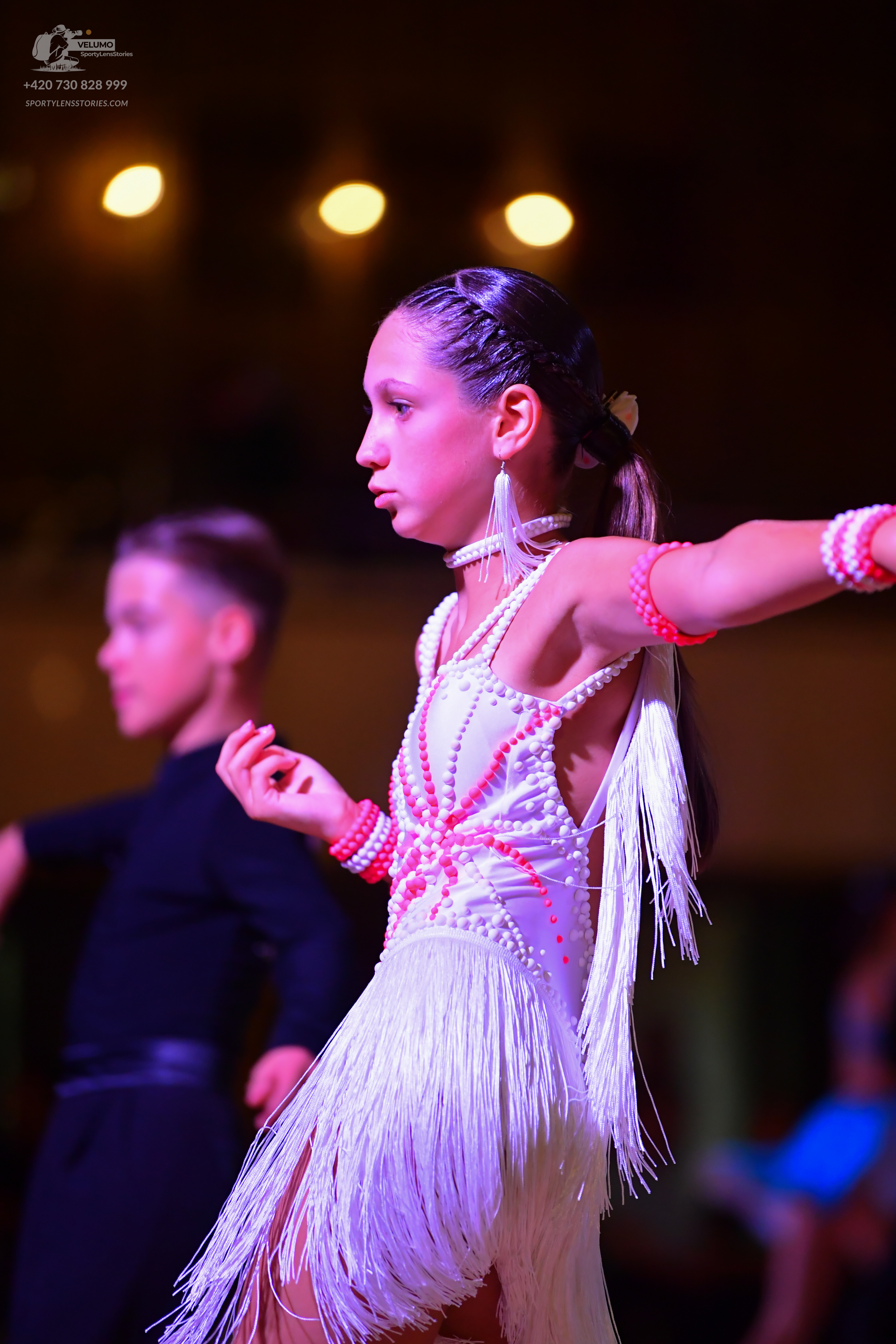 Dancesport competitor: Male:** Black tail suit with a white sequin lapel detail