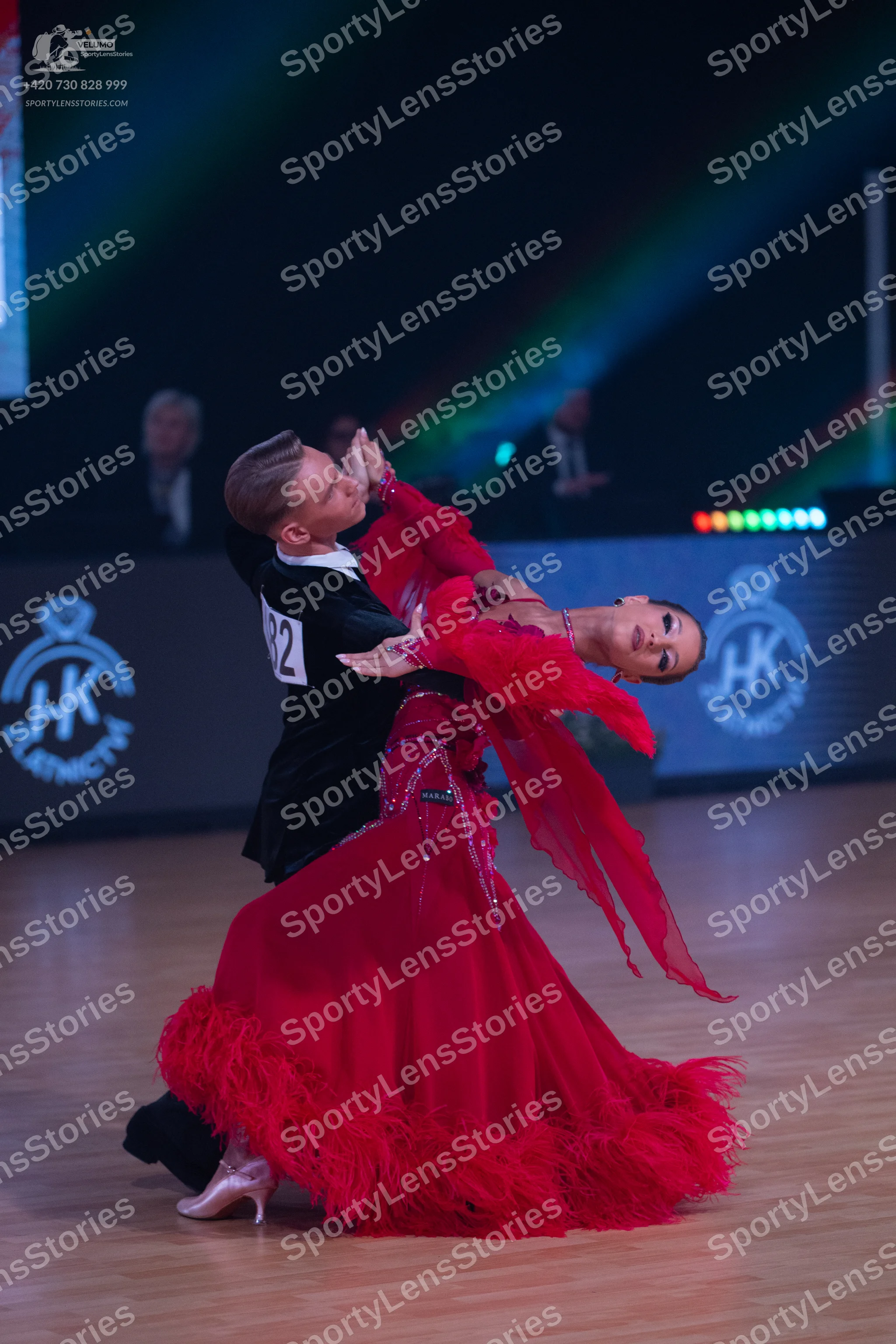 Dancesport competitor: Male dancer: black suit with a white shirt