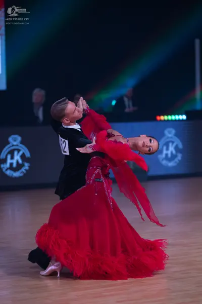 Dancesport competitor: Male dancer: black suit with a white shirt