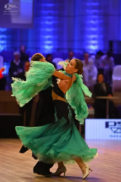 Dancesport competitor: Male dancer: black suit
