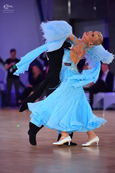 Dancesport competitor #145: Male dancer: black ballroom tailcoat with black trousers and black shoes