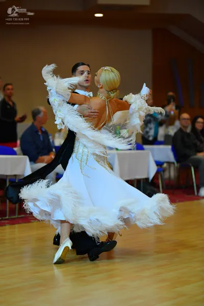 Dancesport competitor: Male dancer: black suit