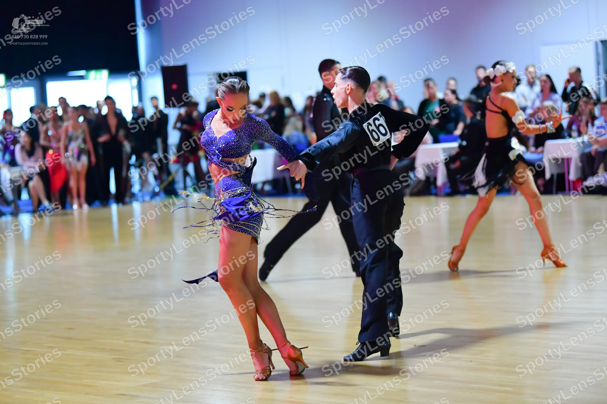 Dancesport competitor #66: Female dancer: purple latin dress with sequins and long sleeves