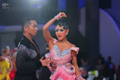Dancesport competitor: Male dancer: black long-sleeved shirt with silver sequins on the shoulder