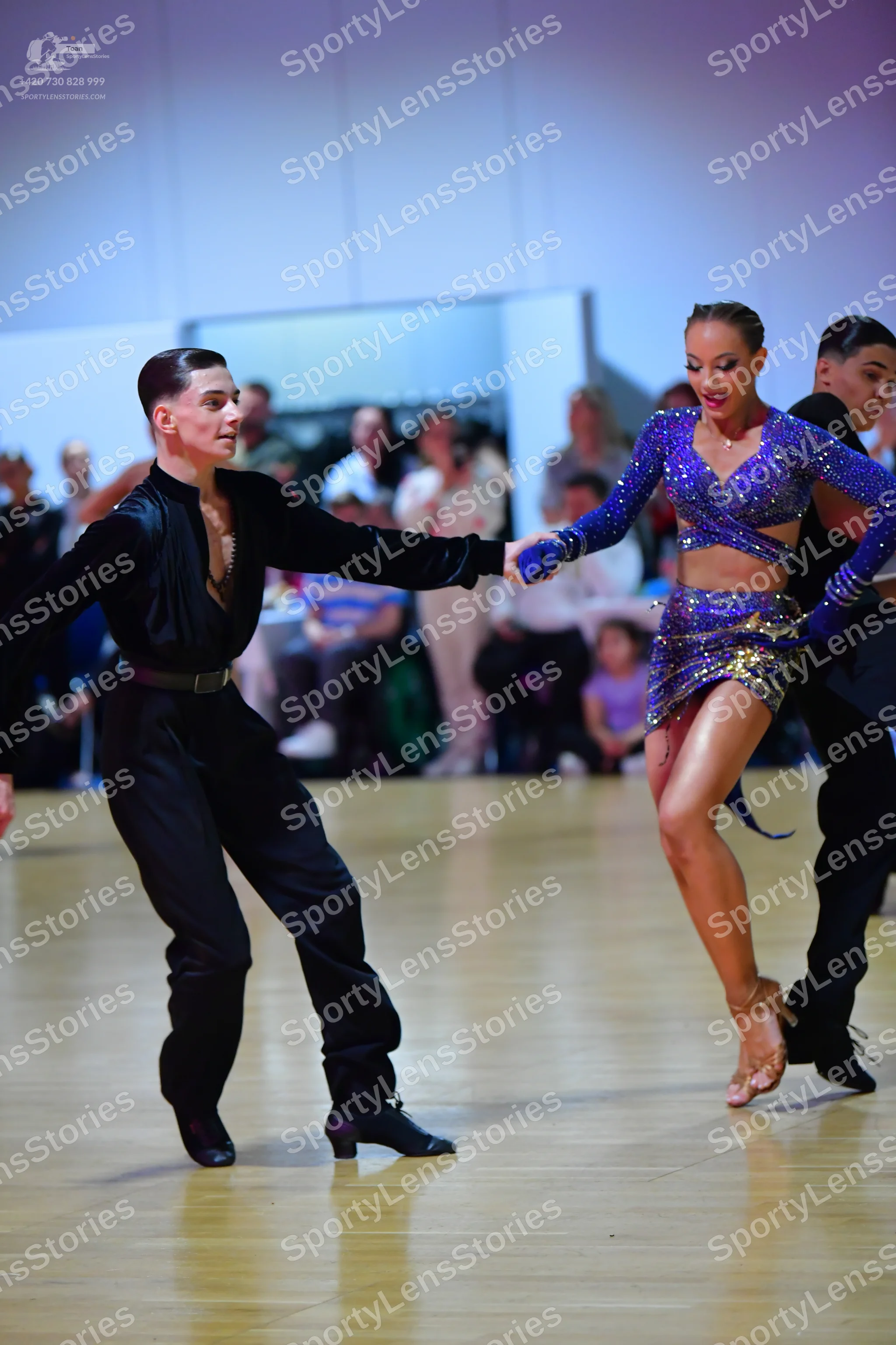 Dancesport competitor: Male dancer: black long-sleeved shirt and black trousers