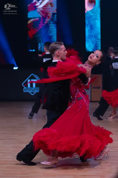 Dancesport competitor: Male dancer: black dance suit