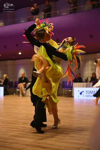 Dancesport competitor: Male dancer: black long-sleeved top and black trousers