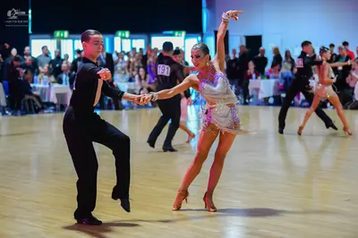Dancesport competitor #18, #191: Male dancers: black long-sleeved shirts and black trousers