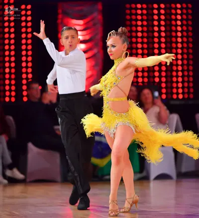 Dancesport competitor: Male dancer: white long-sleeved shirt and black trousers
