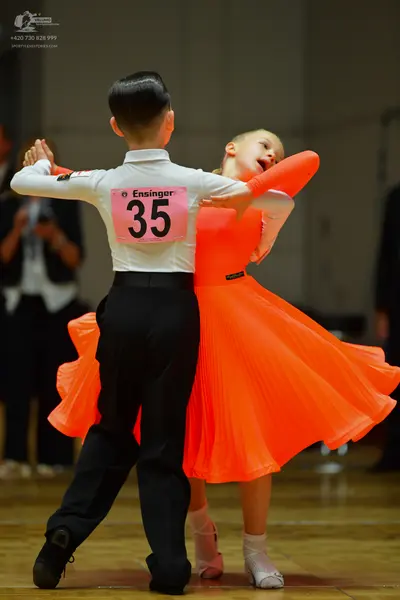 Dancesport competitor #35: Male dancer: white long-sleeved shirt and black trousers