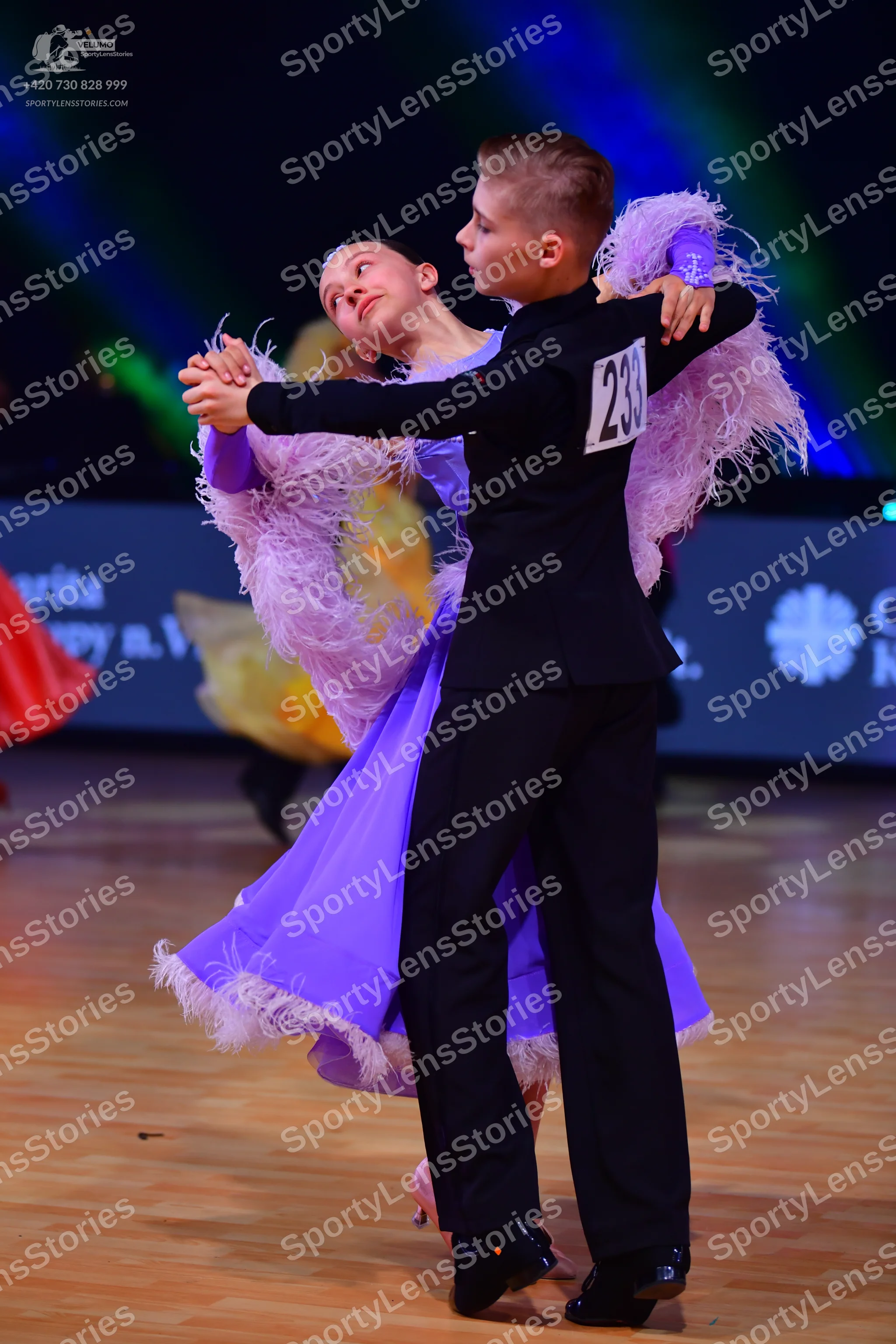 Dancesport competitor: Male dancer: black long-sleeved top and black trousers