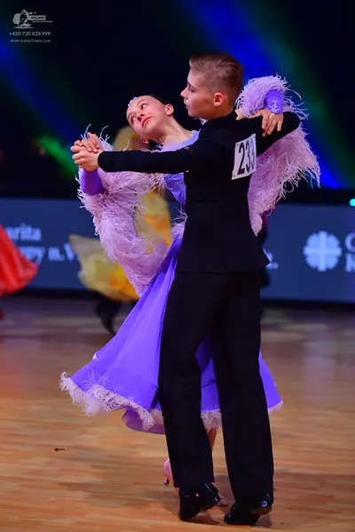 Dancesport competitor: Male dancer: black long-sleeved top and black trousers