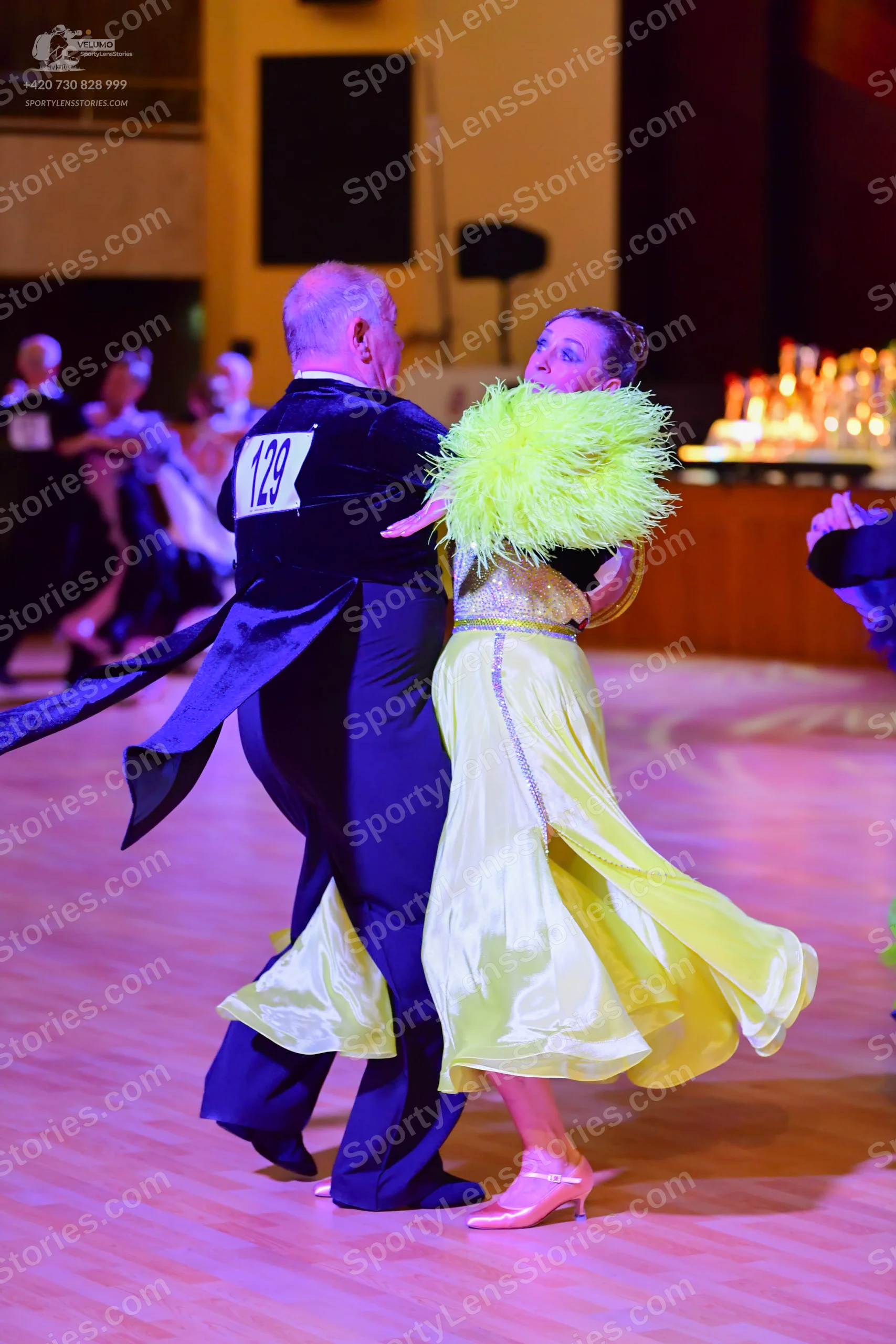 Dancesport competitor: Black suit with a white sequin lapel, black trousers, and black shoes