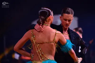 Dancesport competitor: Male dancer: black textured Latin costume