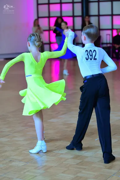 Dancesport competitor #392: Male dancer: white long-sleeved shirt and black trousers