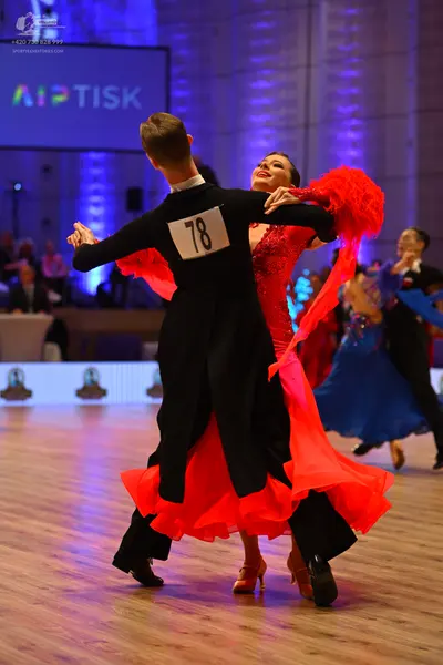 Dancesport competitor: Male dancer: black long-sleeved shirt and black trousers