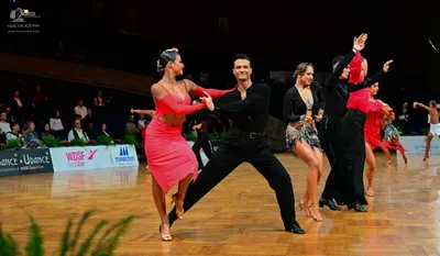 Dancesport competitor: Female dancer: red latin dress with thin straps