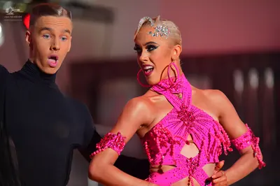 Dancesport competitor: Male dancer: black long-sleeved turtleneck top