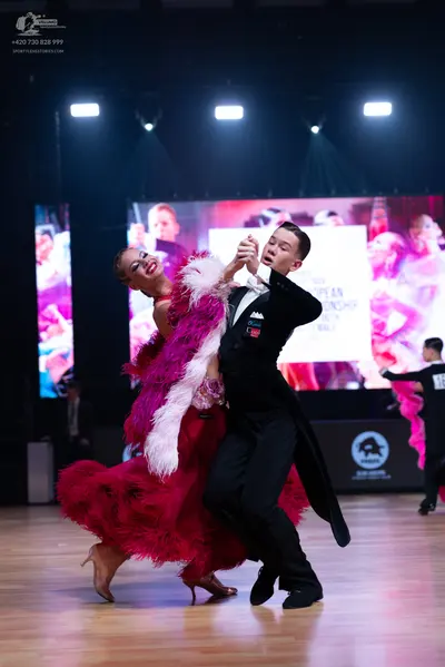 Dancesport competitor: Male dancer: black tailcoat suit with white shirt and black trousers