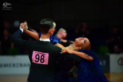 Dancesport competitor: Male dancer: black suit