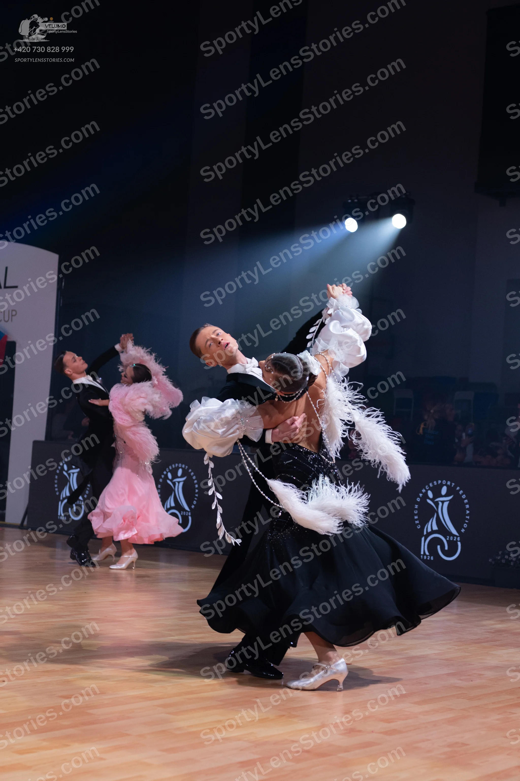 Dancesport competitor: Male dancers: black suits with white shirts