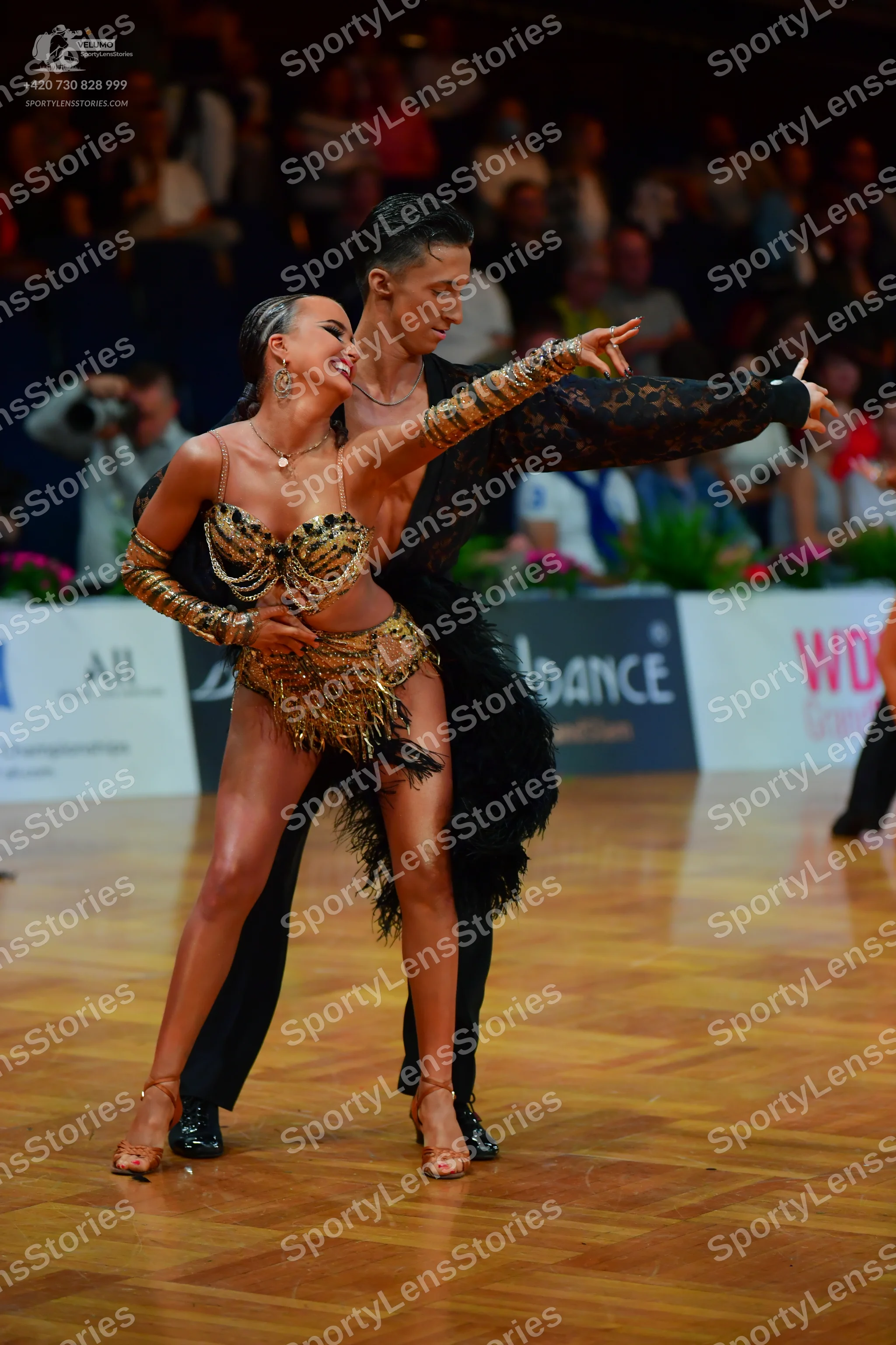Dancesport competitor: Male dancer: black patterned long-sleeve shirt and black trousers