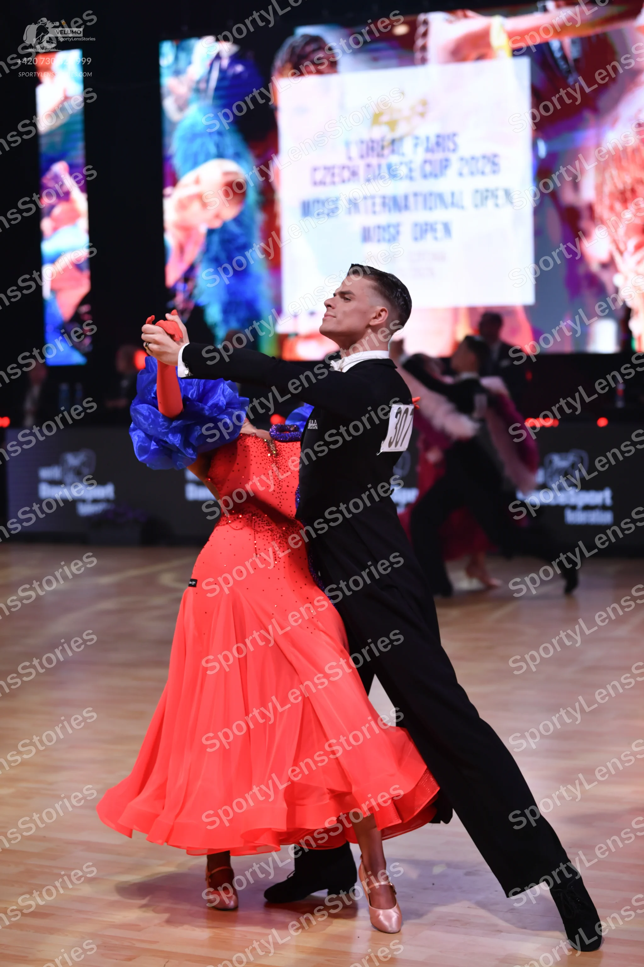 Dancesport competitor: Male dancer: black suit with a white shirt collar