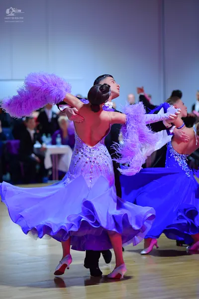 Dancesport competitor: Female dancer 1: lavender ballgown with a sequined bodice and a voluminous, ruff