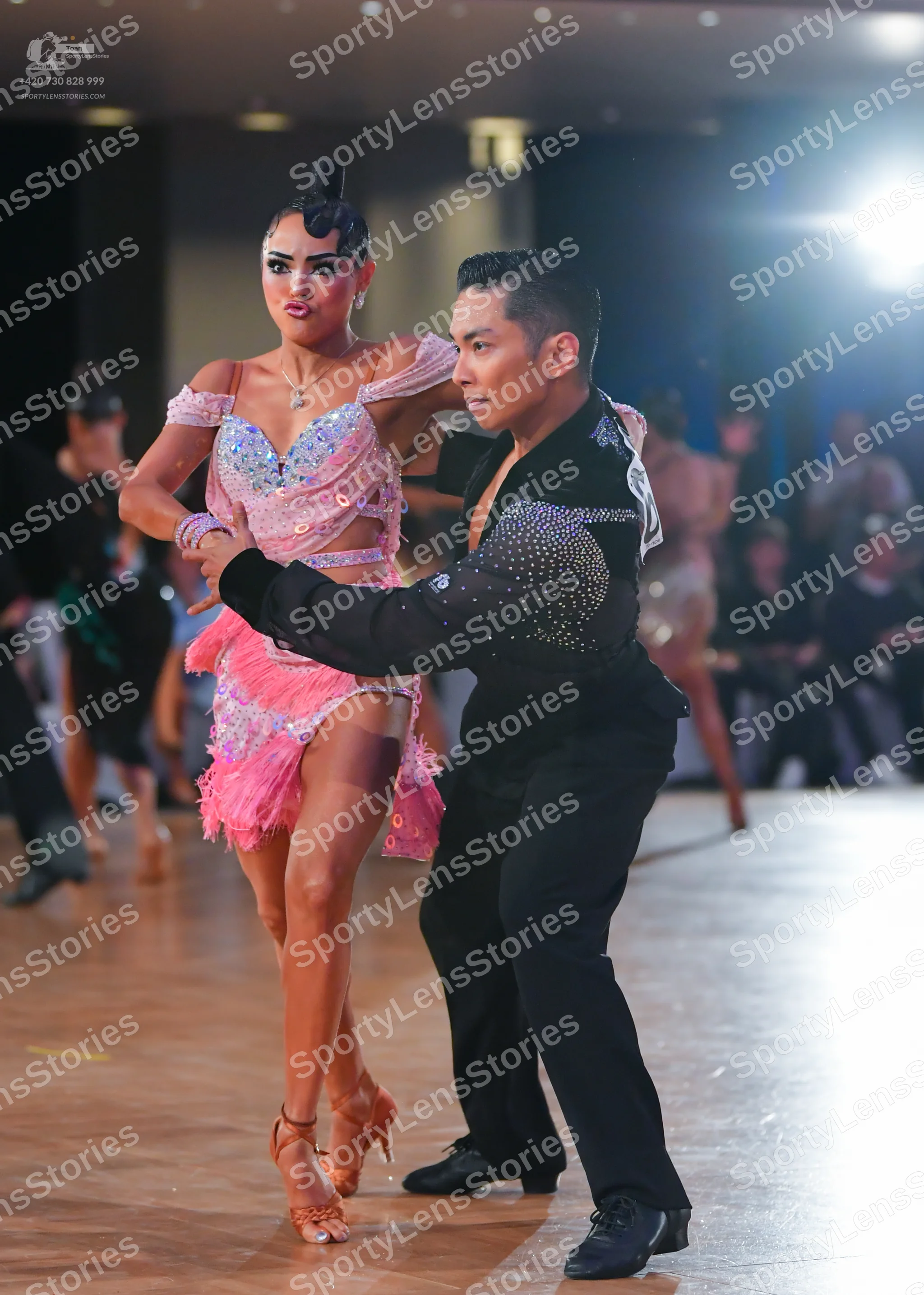Dancesport competitor: Male dancer: black latin dance shirt with silver sequin embellishments on the sh